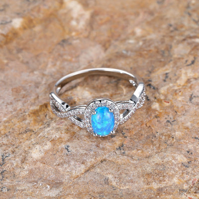 Artistic Retro White K Egg-shaped Blue Opal Edge White Diamond Lace Ring
