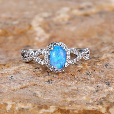 Artistic Retro White K Egg-shaped Blue Opal Edge White Diamond Lace Ring
